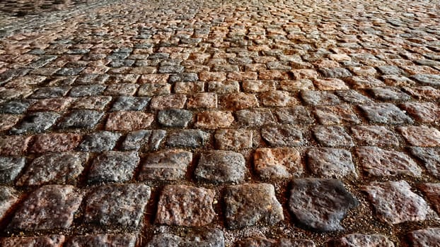 Stone, cobblestone or bricks pavement texture and background. Old World Charm. Abstract pattern, frame, place for text, copy space