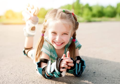 Little girl in roller skates at a park