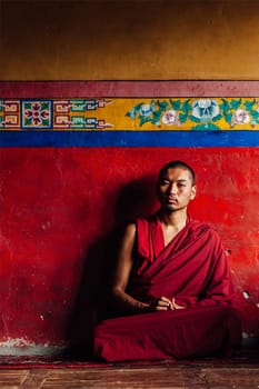 DISKIT, INDIA - SEPTEMBER 12, 2012: Tibetan Buddhist monk in Diskit gompa. Diskit gompa is the oldest and largest Buddhist monastery (gompa) in the Nubra Valley of Ladakh, India