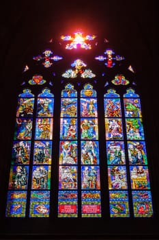 PRAGUE, CZECH REPUBLIC - APRIL 27, 2012: Stained-glass Window designed by famous Czech Art Nouveau painter Alfons Mucha in St. Vitus cathedral in Prague, Czech republic