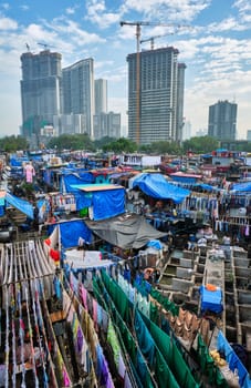 MUMBAI, INDIA - OCTOBER 31, 2019: Dhobi Ghat Mahalaxmi Dhobi Ghat is open air laundromat lavoir in Mumbai, India with laundry drying on ropes. Now signature landmark tourist attractions of Mumbai