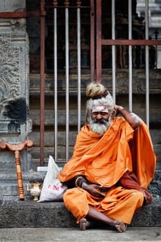 TIRUVANAMALLAI, INDIA - JANUARY 7, 2010: Sadhu - religious ascetic or holy person - in Hindu temple Arunachaleswar. Tiruvanamallai, Tamil Nadu, India