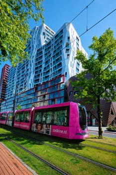 ROTTERDAM, THE NETHERLANDS - MAY 11: Modern tram in street of Rotterdam, Netherlands