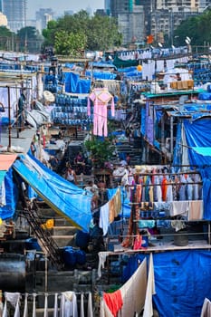 Mumbai, India - October 31, 2019: Dhobi Ghat Mahalaxmi Dhobi Ghat is open air laundromat lavoir in Mumbai, India with laundry drying on ropes. Now signature landmark tourist attractions of Mumbai