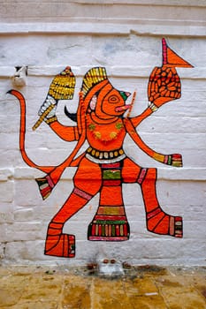 Jaisalmer, India - November 16, 2019: Hanuman Indian Hindu god image painted on wall. Jaiasalmer, Rajasthan, India