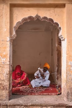 Jodhpur, India - November 13, 2019: Musicians playing in singing traditional folk Rajasthani songs and music in Mehrangarh fort, Rajasthan, India