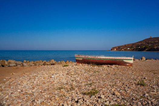 A Broken migrant boat stranded on the beach of the Agrigento coast