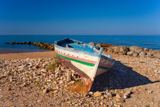 A Broken migrant boat stranded on the beach of the Agrigento coast