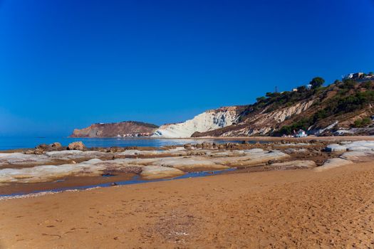 View of the limestone white cliffs with beach at the Scala dei Turchi in English Stair of the Turks near Realmonte in Agrigento province. Sicily, Italy