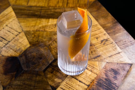 Fresh cocktail with orange and ice. Alcoholic, non-alcoholic drink-beverage at bar counter.