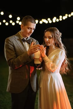 transfer of wedding fire with the help of candles from mothers to the newlyweds