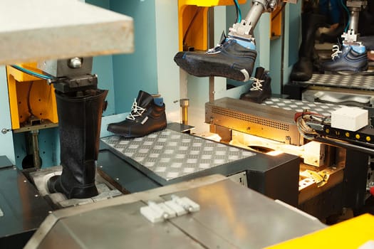 Manufacture of leather footwear in factory's workshop