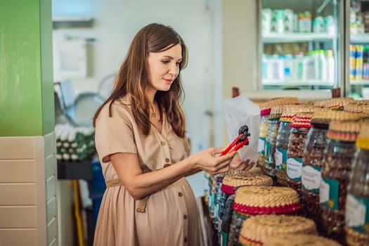 A glowing pregnant woman after forty makes a healthy choice as she selects organic vegetables and fruits at the vibrant organic market, prioritizing her well-being and her baby's health.
