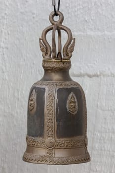 Big brass bells are commonly hung in Thai temples.