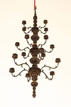 Candlestick, old brass, hanging on the ceiling