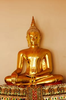 Beautiful golden Buddha On the pedestal, some white walls