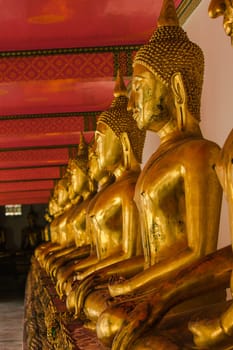 Beautiful golden Buddha On the pedestal, some white walls