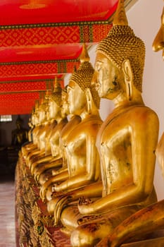 Beautiful golden Buddha On the pedestal, some white walls