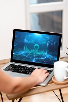 Hand Resting On Laptop Top Of Table Beside Cup Working From Home.