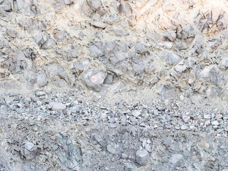 Detail of a stone pit in stone quarry. Industrial site, granite gravel mining in open pit.