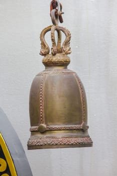 Big brass bells are commonly hung in Thai temples.