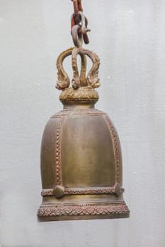 Big brass bells are commonly hung in Thai temples.