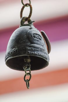 Small brass bells are commonly hung in Thai temples.