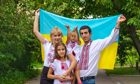 Family Ukrainians in vyshyvanka patriots. Selective focus. Couple.