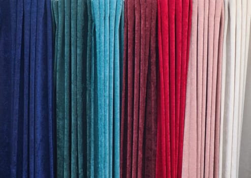 Samples of cloth and fabrics in different colors found at a fabrics market.