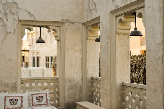 Narrow streets that create shade on a hot day in the old city of Dubai Creek and Bur district. Travel destinations and heritage village.