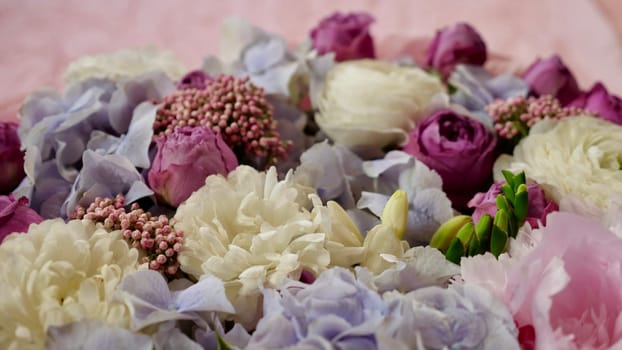 Floral natural background with blue gardenia, pink rose, white chrysanthemum close-up