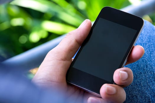 close up of man using smartphone