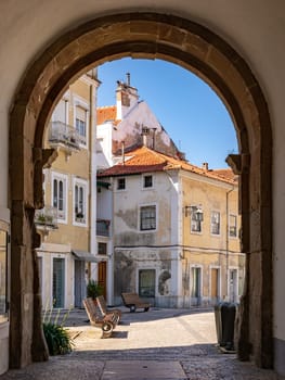 Archway and city gate are passage from Cathedral Square to Republic Square at Praca da Republica in Alcobaca, Portugal