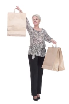 in full growth. elegant young woman with shopping bags . isolated on a white background.