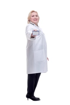 Portrait of beautiful doctor holding business card isolated on white background