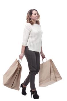 casual young woman with shopping bags. isolated on a white background.