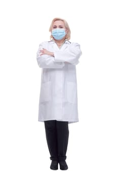 Confident woman doctor wearing medical mask standing with crossed arms. isolated female portrait.