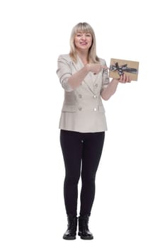 full-length. a friendly adult woman with a gift box looking at you . isolated on a white background.