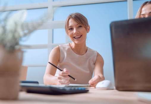 young business woman sitting at office Desk. photo with space for text