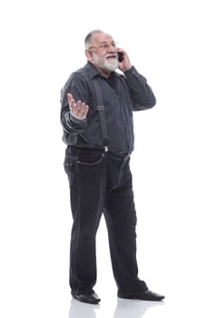in full growth. friendly elderly man with a smartphone. isolated on a white