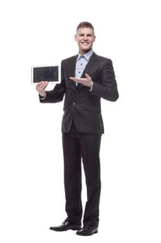 in full growth. happy young businessman with a digital tablet . isolated on a white background.