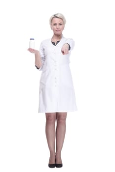 in full growth. female doctor holds a bottle of sanitizer. isolated on a white background.