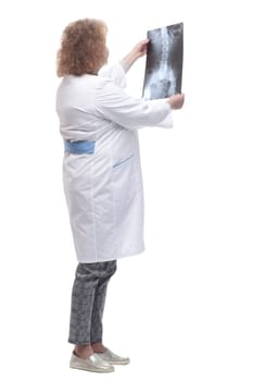 full-length. senior female doctor with x-ray. isolated on a white background.
