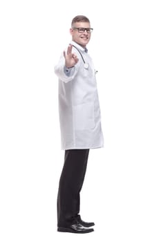 in full growth. confident young doctor with a stethoscope. isolated on a white background.