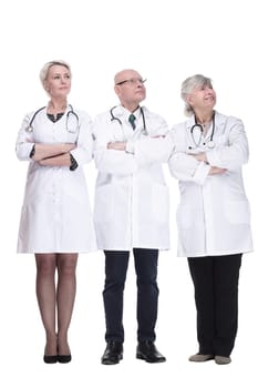 in full growth. experienced doctors colleagues standing together. isolated on a white background.