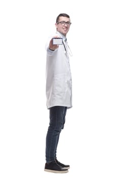 doctor with a stethoscope showing his business card. isolated on a white background.