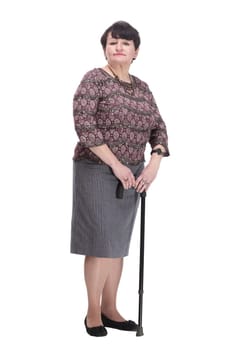 full-length. casual elderly woman with a walking stick. isolated on a white background.