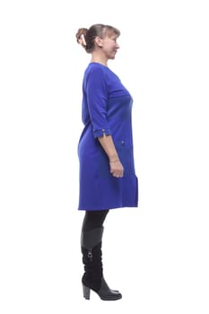 Side view of pretty woman standing over white background wearing elegant dress and pointed at you