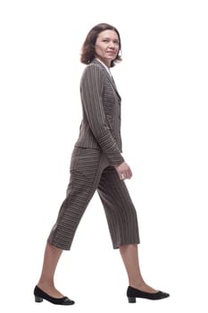 in full growth. modern business woman stepping forward. isolated on a white background.