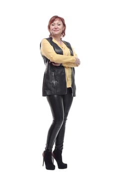 attractive mature woman in leather trousers and vest. isolated on a white background.